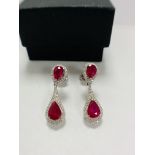 14ct White Gold Ruby and Diamond drop earrings featuring, 4 pear cut, deep pinkish red Rubies (2.68c