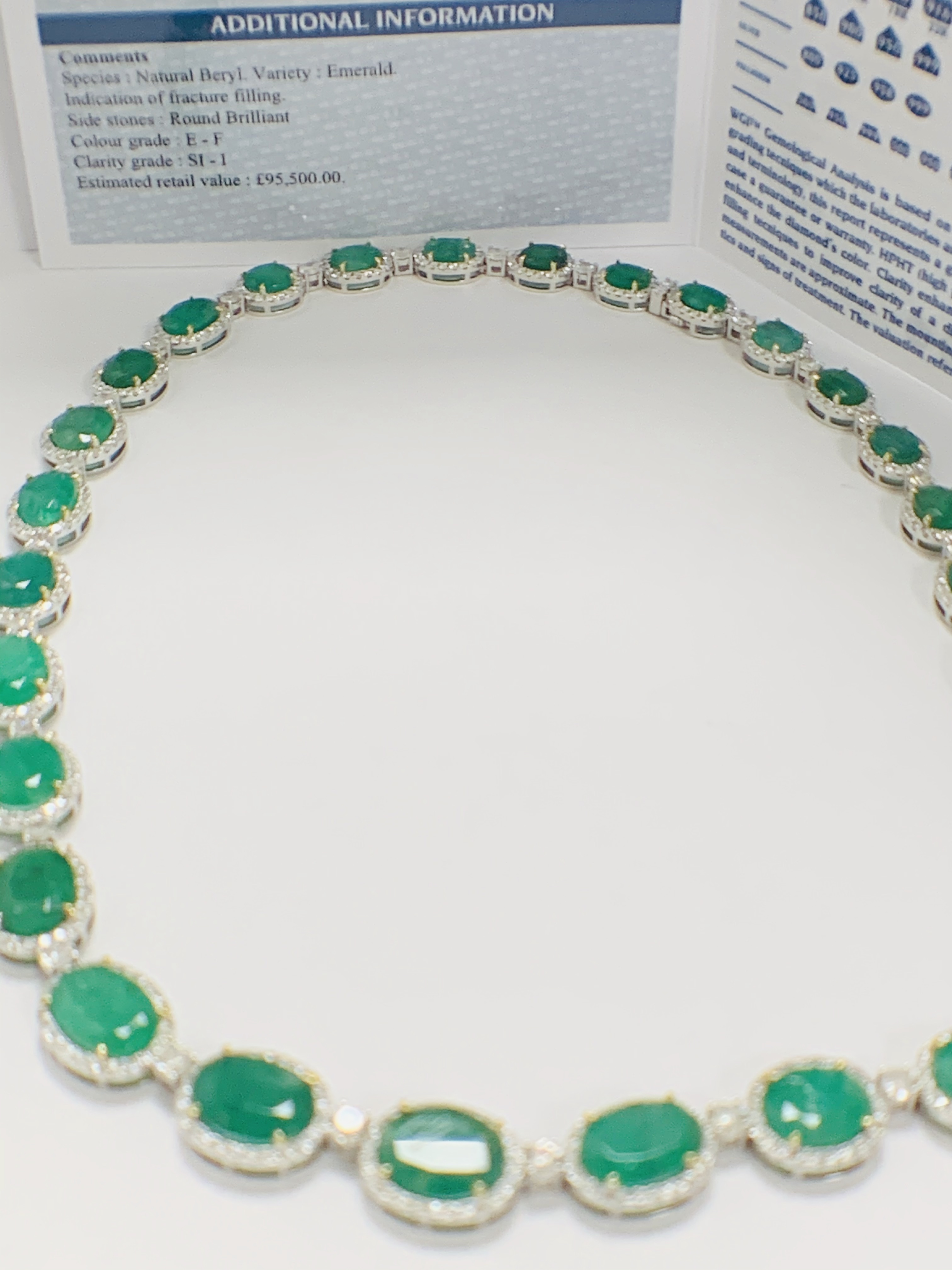 Platinum and Yellow Gold Emerald and Diamond necklace featuring, 29 oval cut, light to deep green Em - Image 35 of 36