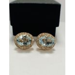 14ct Rose Gold Aquamarine and Diamond stud earrings featuring, 2 oval cut, light blue Aquamarines (5