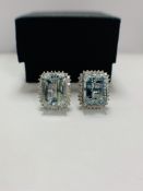 14ct White Gold Aquamarine and Diamond stud earrings featuring, 2 emerald cut, light blue Aquamarine