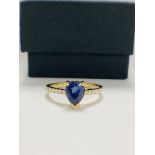 14ct Yellow Gold Sapphire and Diamond ring featuring centre, pear cut, medium blue Sapphire (1.01ct)
