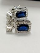14ct White Gold Sapphire and Diamond earrings featuring centre, 2 emerald cut, dark vivid blue Sapph