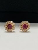 14ct Rose Gold Ruby and Diamond flower design stud earrings featuring centre, 2 round cut, pinkish r