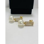 14ct Yellow Gold Pearl and Diamond drop earrings featuring, 2 white South Sea Pearls, with 44 round