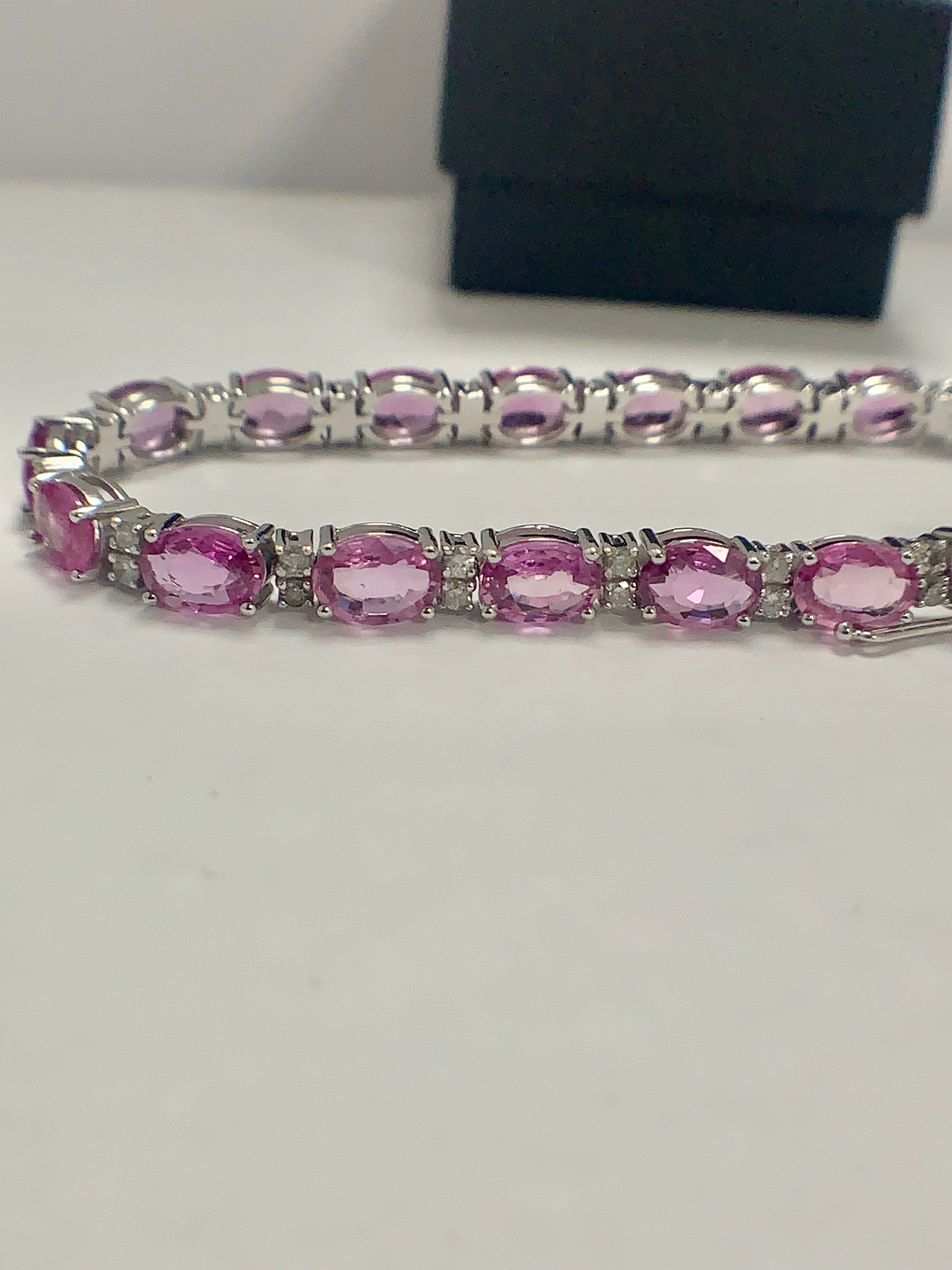 14ct White Gold Sapphire and Diamond bracelet featuring, 19 oval cut, pink Sapphires (15.93ct TSW) - Image 8 of 11