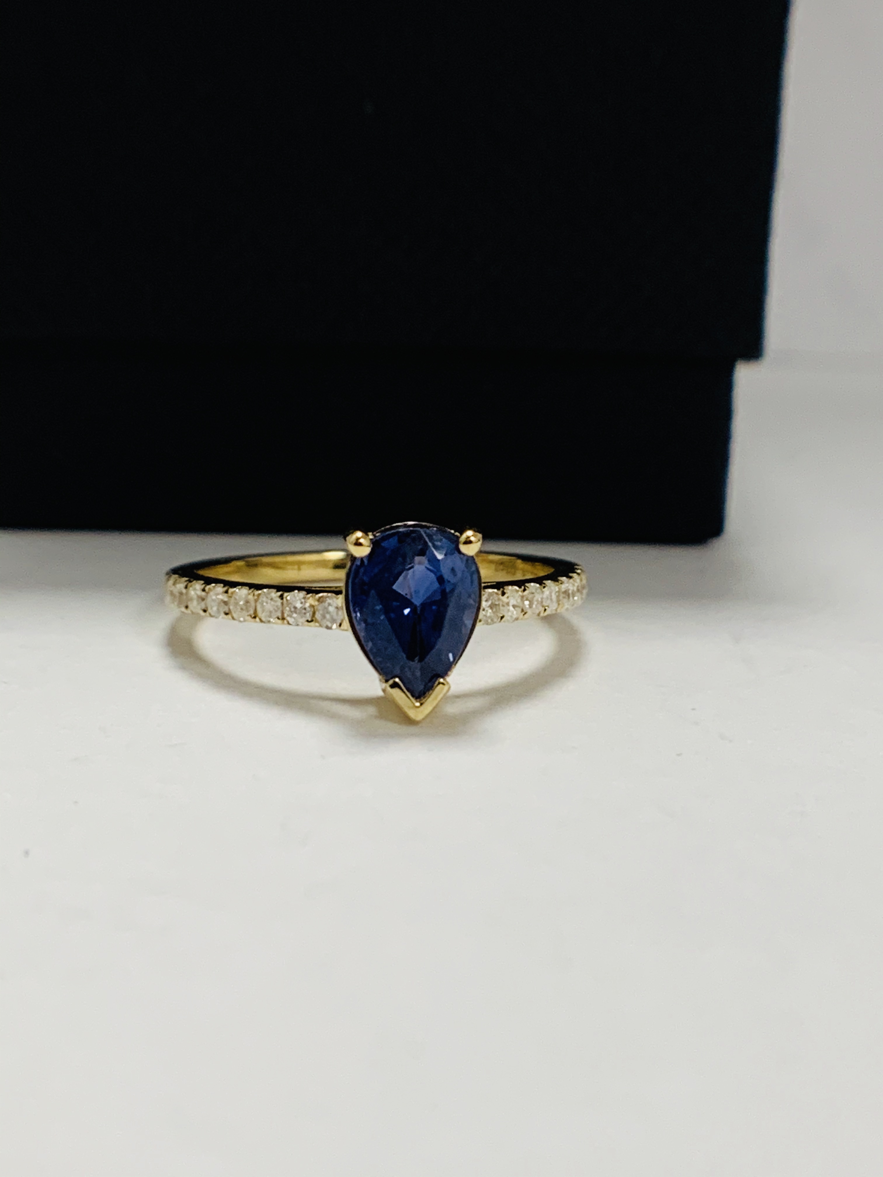 14ct Yellow Gold Sapphire and Diamond ring featuring centre, pear cut, medium blue Sapphire (1.01ct) - Image 9 of 12