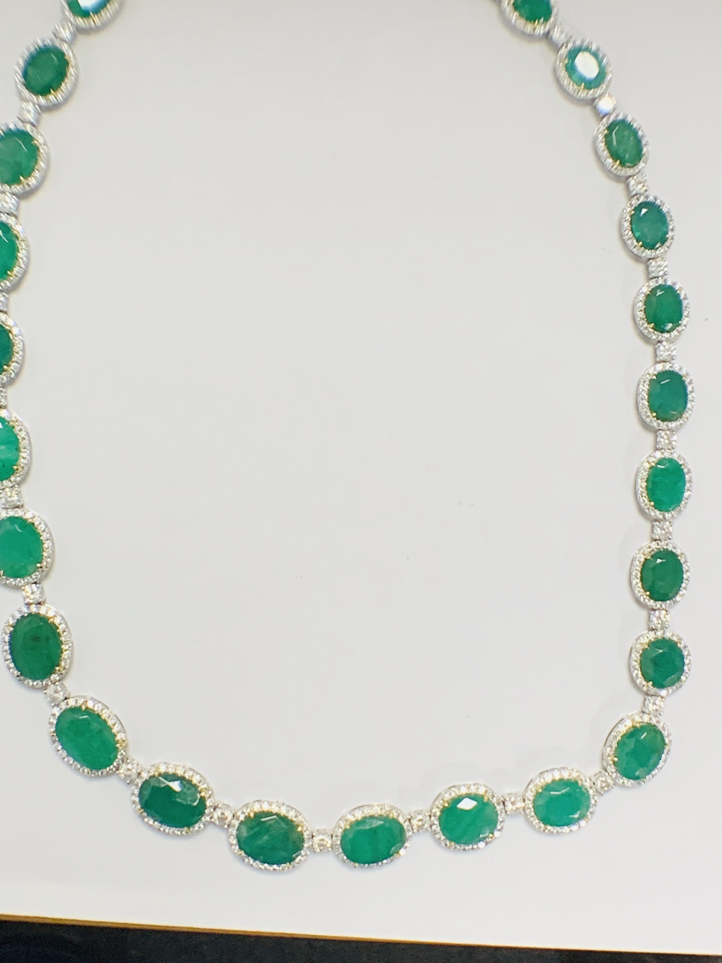 Platinum and Yellow Gold Emerald and Diamond necklace featuring, 29 oval cut, light to deep green Em - Image 33 of 36