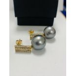 14ct White Gold Pearl and Diamond drop earrings featuring, 2 black South Sea Pearls, with 44 round b
