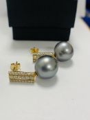 14ct White Gold Pearl and Diamond drop earrings featuring, 2 black South Sea Pearls, with 44 round b