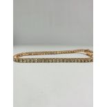 14ct Rose Gold Diamond tennis bracelet featuring, 59 round brilliant cut Diamonds (5.20ct TDW), claw