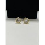 14ct Yellow Gold Diamond stud earrings featuring, 2 round brilliant cut Diamonds (1.01ct TDW), bezel