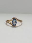 14ct Rose Gold Sapphire and Diamond ring featuring centre, oval cut, blue Sapphire (1.10ct), claw se