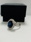 14ct White Gold Sapphire and Diamond ring featuring, oval cut, deep vivid blue Sapphire (3.07ct), cl