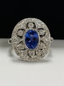 18ct White Gold Tanzanite and Diamond ring featuring centre, oval cut Tanzanite (0.84ct), bezel set,