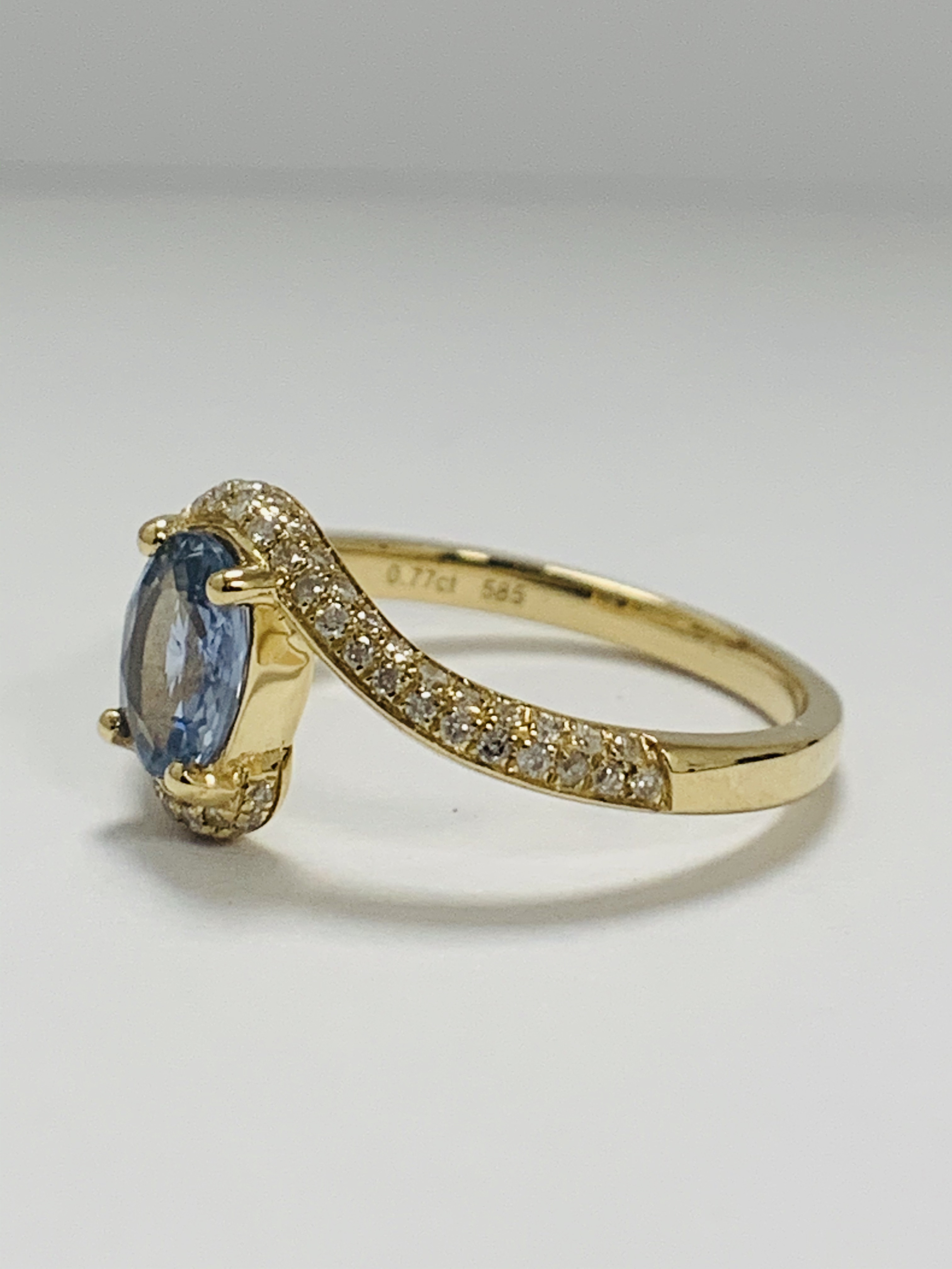 14ct Yellow Gold Sapphire and Diamond ring featuring centre, oval cut, light blue Sapphire (0.77ct), - Image 2 of 10