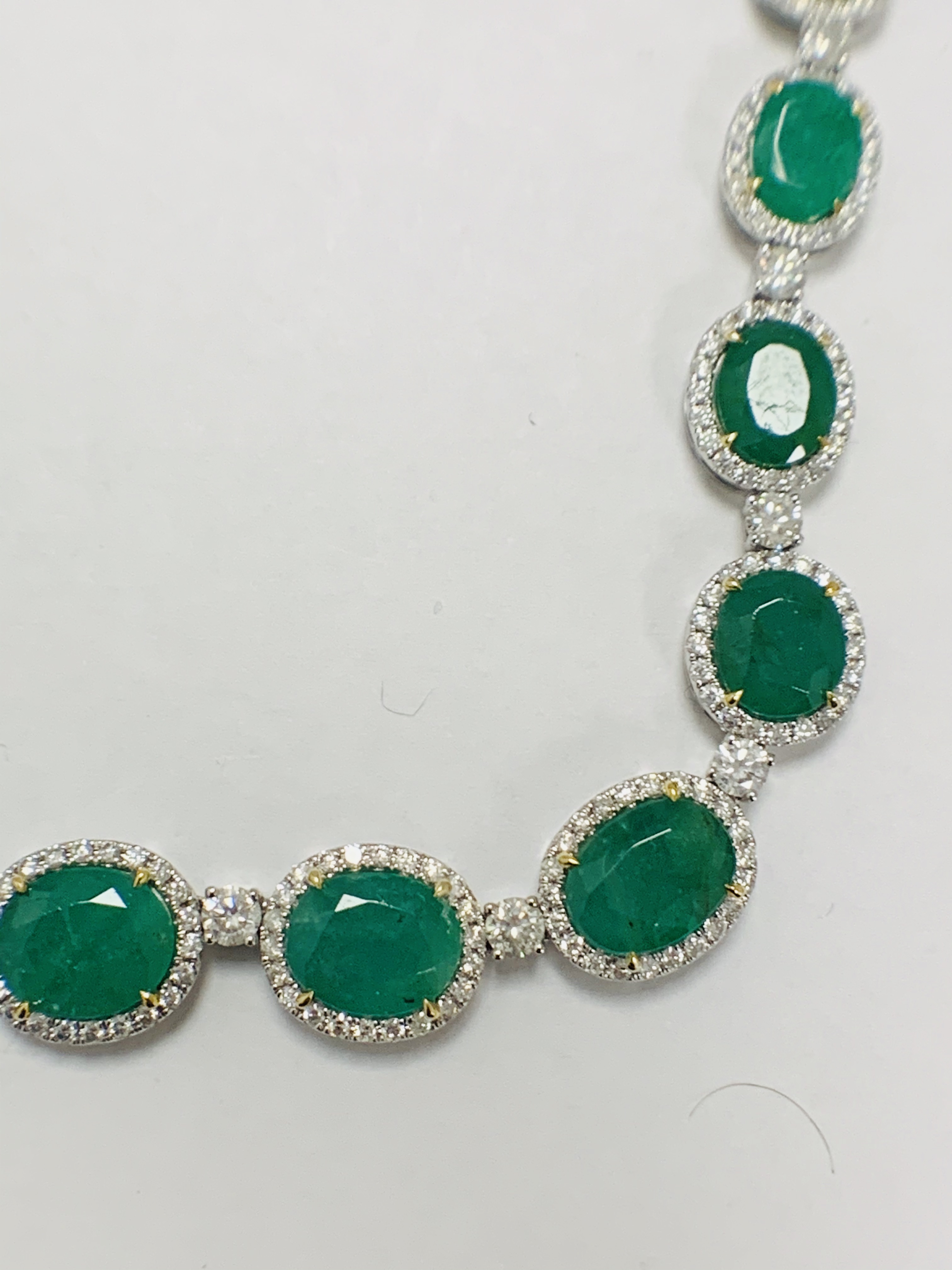 Platinum and Yellow Gold Emerald and Diamond necklace featuring, 29 oval cut, light to deep green Em - Image 30 of 36