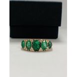 14ct Rose Gold Emerald and Diamond ring featuring centre, 5 oval cut, medium green Emeralds (2.16ct