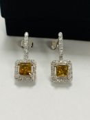 14ct White Gold Yellow Diamond earrings featuring, 2 princess cut, yellow Diamonds (0.99ct TDW), cla