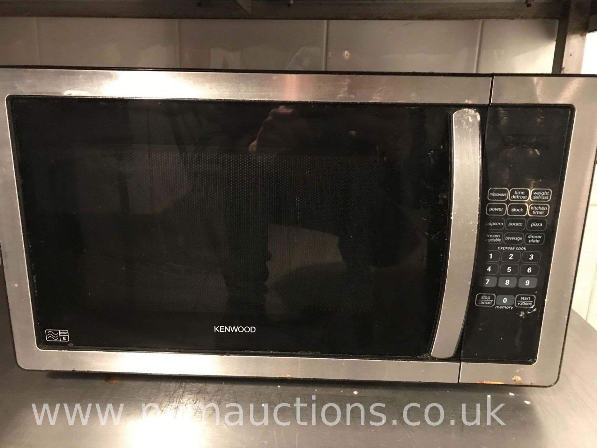 Kenwood microwave and low stainless steel counter on castor wheels