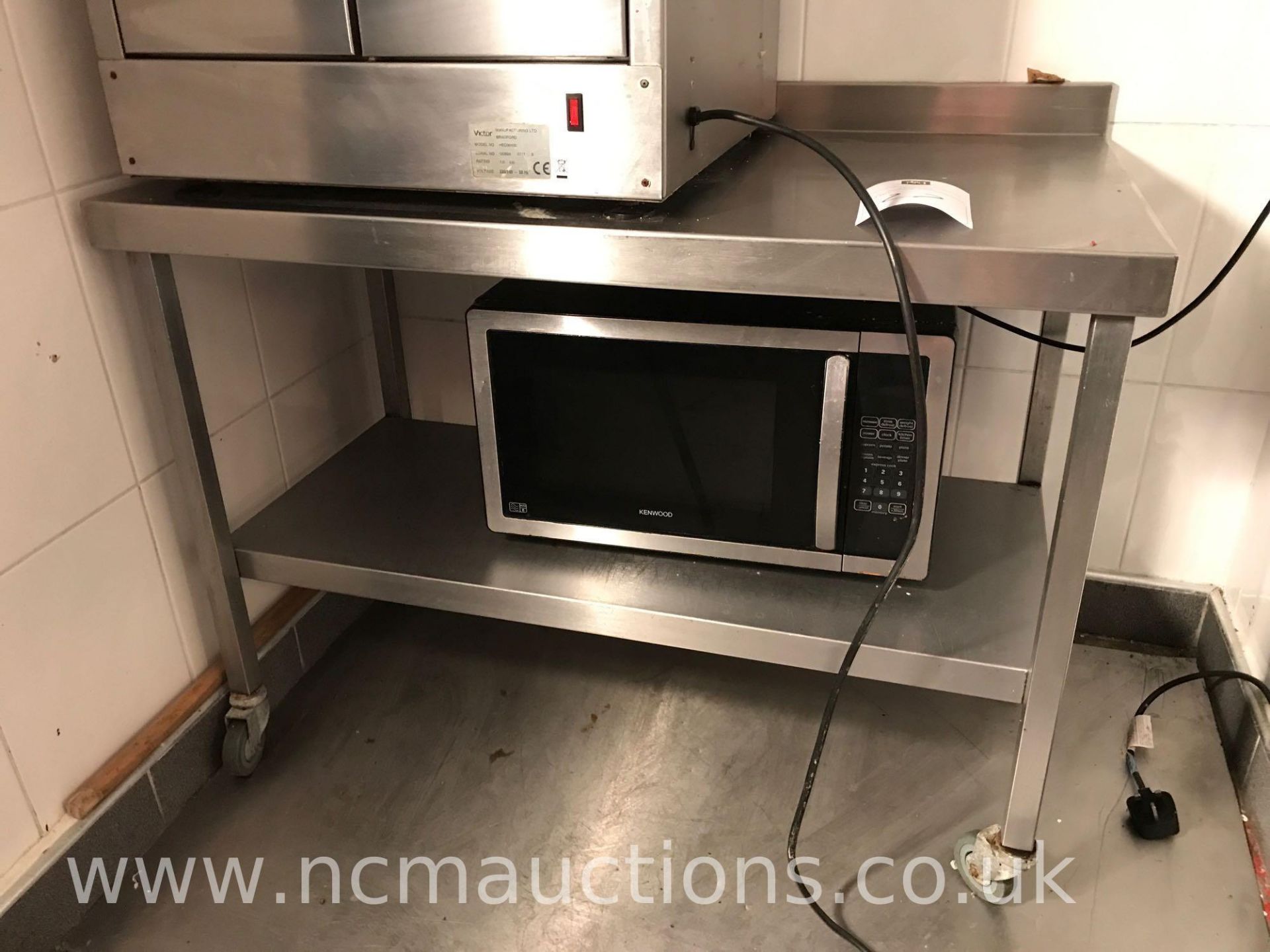 Kenwood microwave and low stainless steel counter on castor wheels - Image 3 of 3