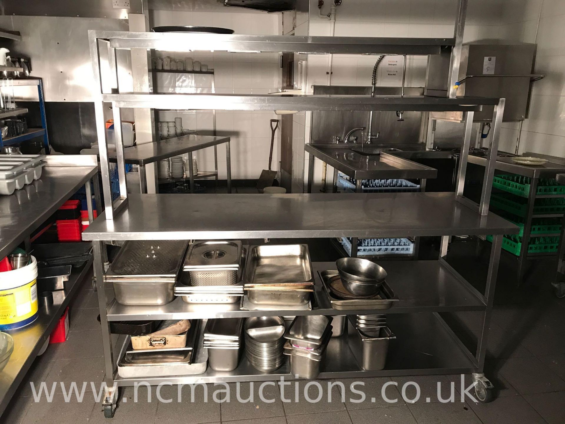 Stainless steel catering bench with top shelf food warmer and under storage