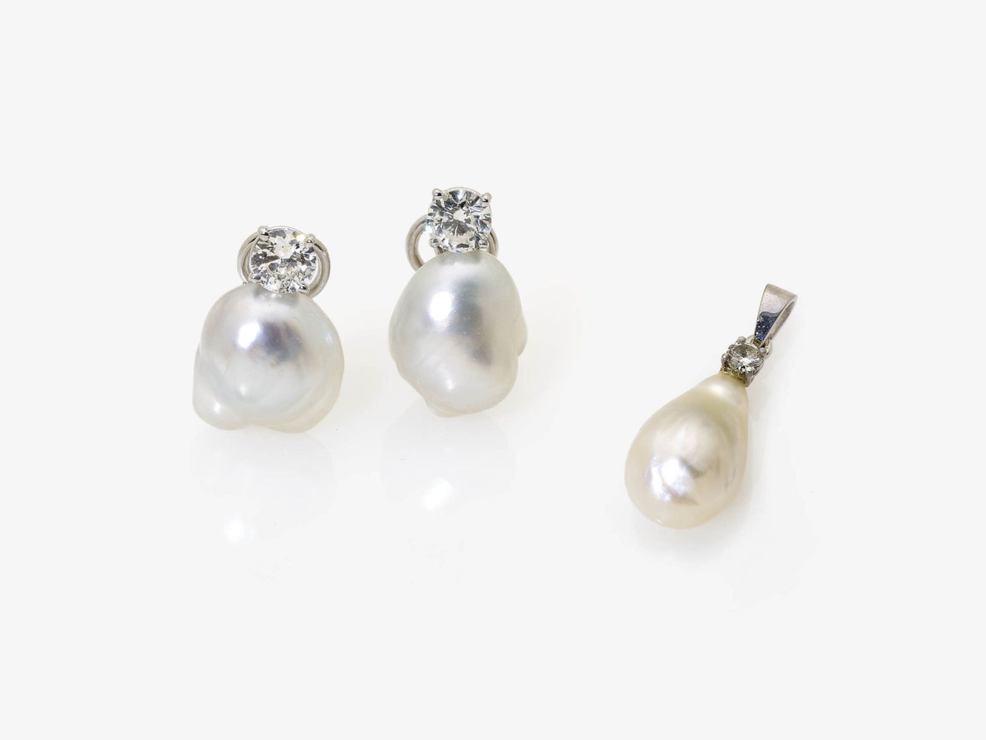 A Pair of Cultured Pearl and Diamond Earrings and a Pendant