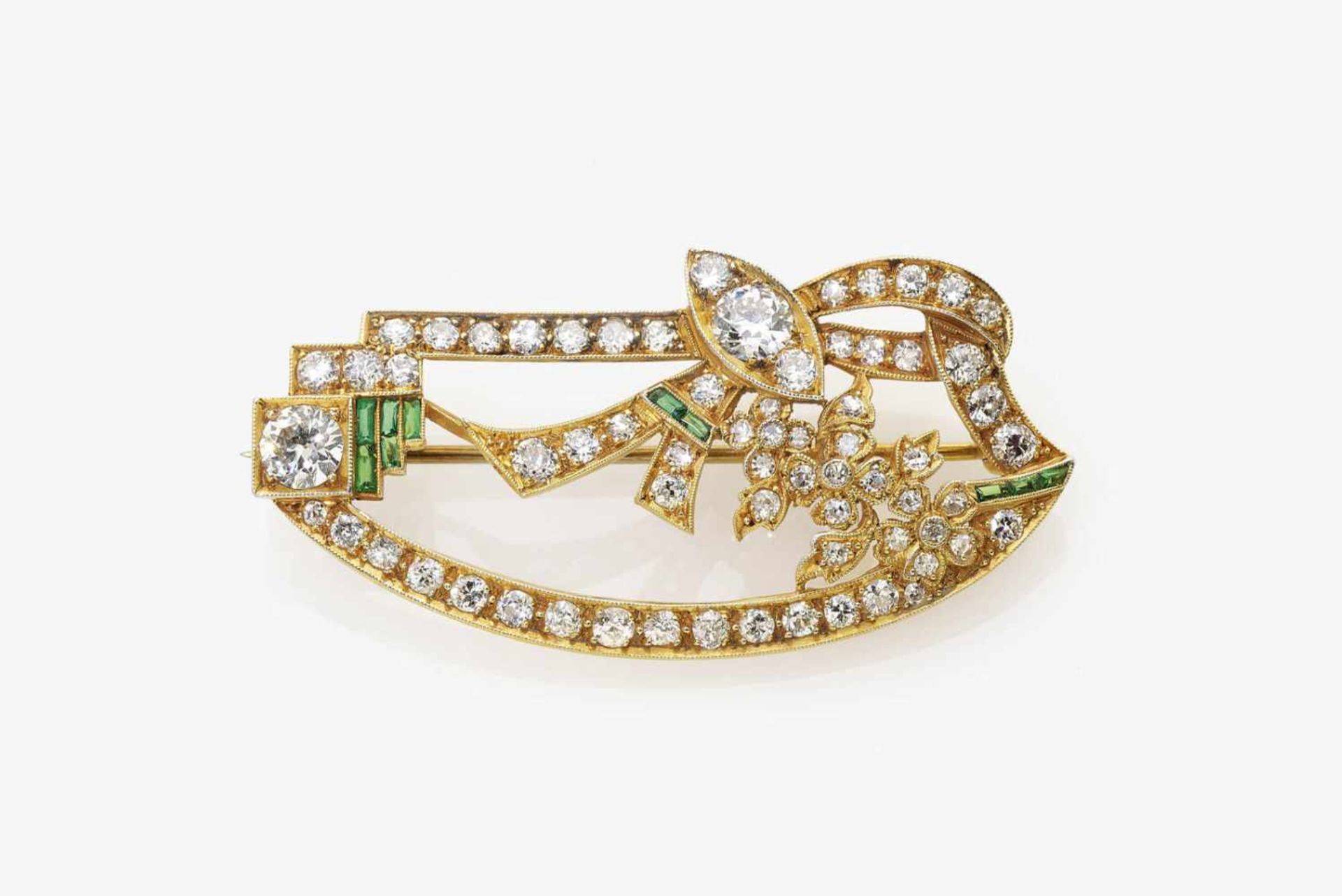 An Emerald and Diamond stylised Floral Brooch