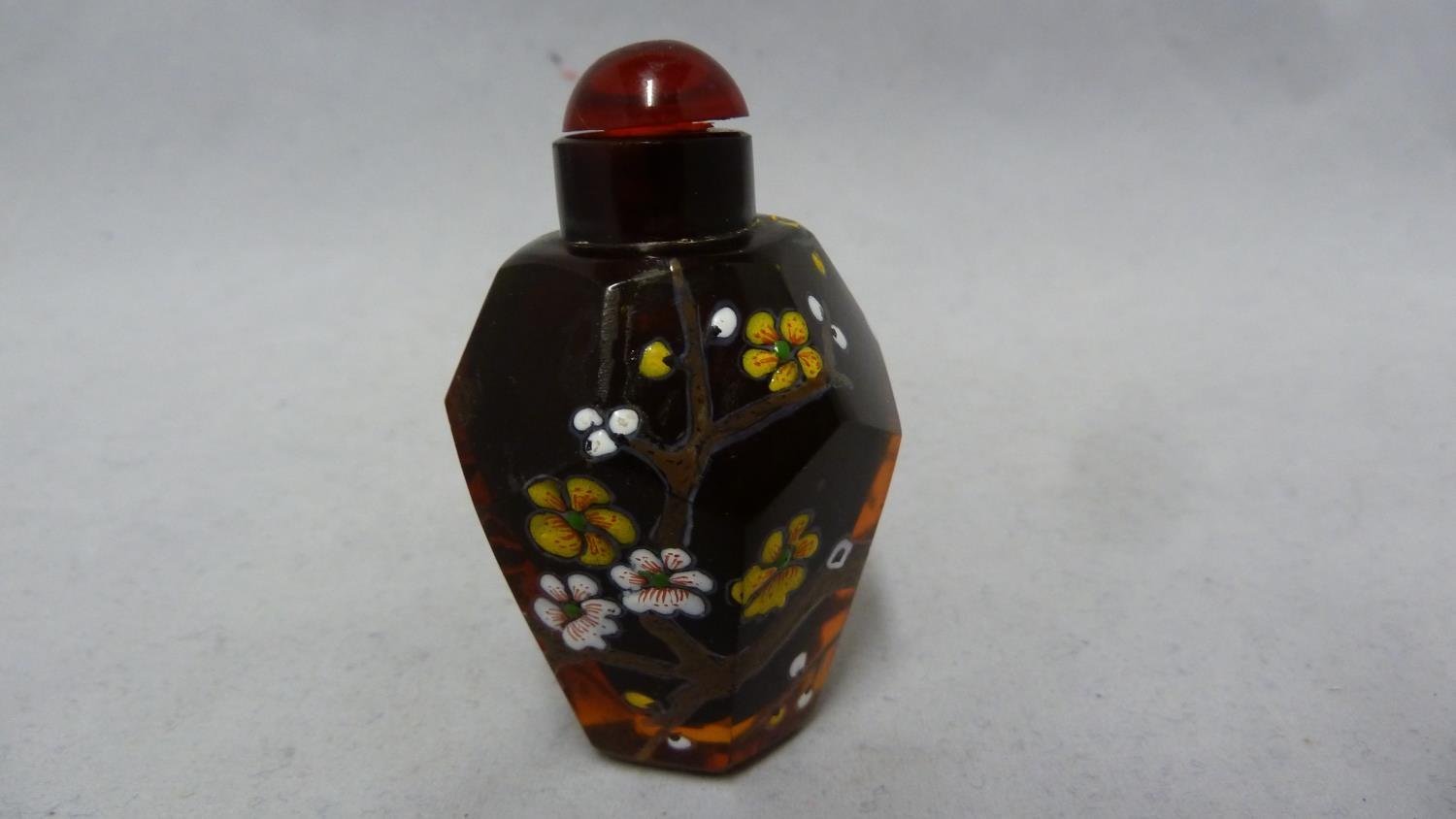 Chinese Glass - a deep amber glass faceted snuff bottle enamelled in polychrome colours with - Image 2 of 5