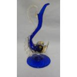 Murano glass - a dolphin form jug, the body of cobalt blue with aventurine gold fins and details,