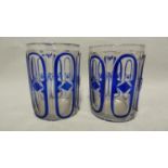 Continental Glass, possibly Russian - two blue cased glass beakers the overlay cut through to