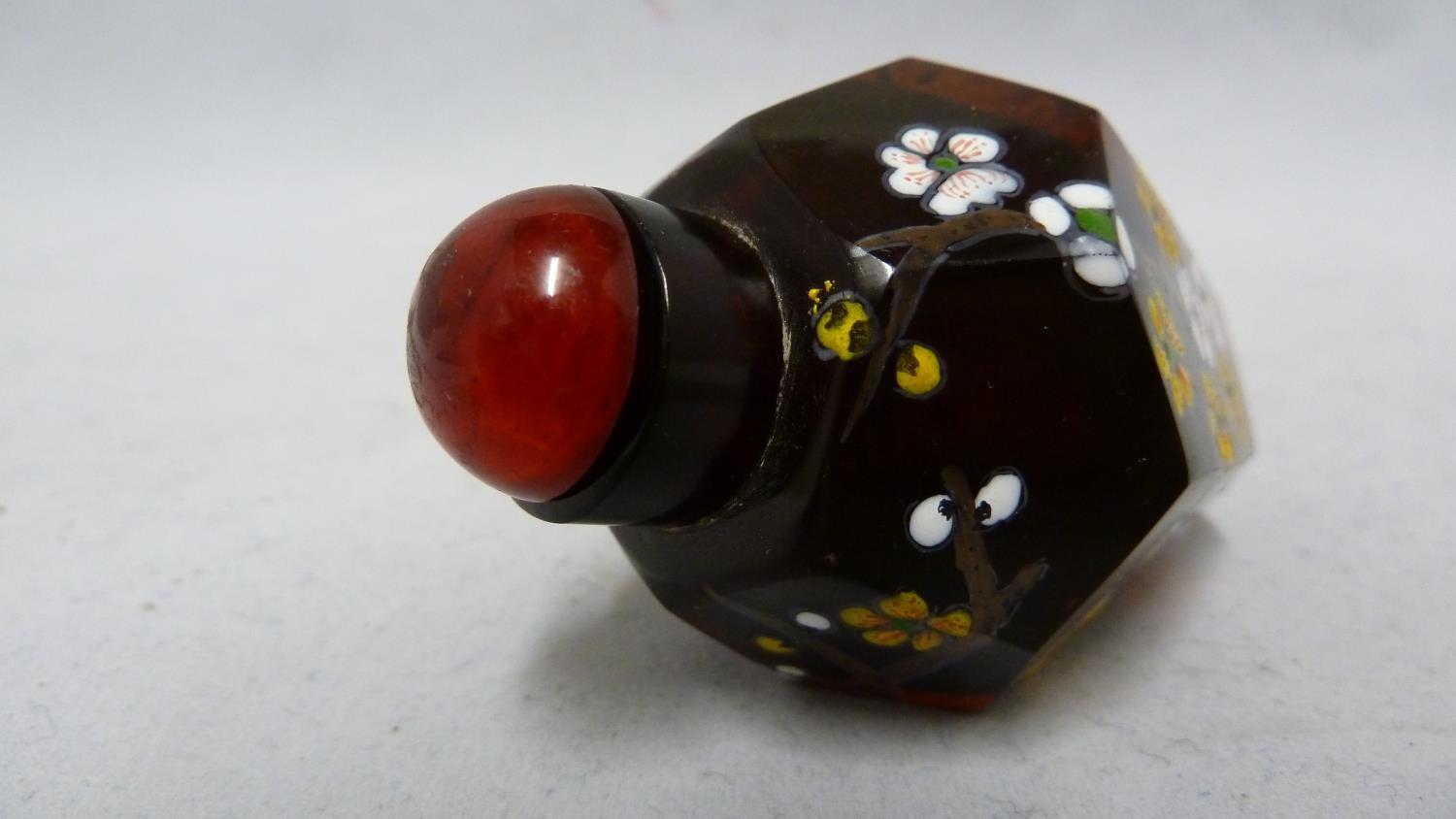 Chinese Glass - a deep amber glass faceted snuff bottle enamelled in polychrome colours with - Image 4 of 5