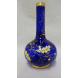 Moser - a cobalt blue bottle vase, enamelled and gilded with oak leaves and branches with applied