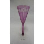 Stevens & Williams - a rose coloured wine glass, of conical bowl, cut with fluting, star and fan