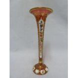 Bohemian Glass - a cased glass solifleur vase, of trumpet form, the white overlay cut through to