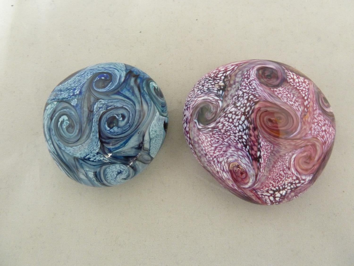 Isle of Wight glass - two Gemstone pebble paperweights, in amethyst and aqua marine colours, partial