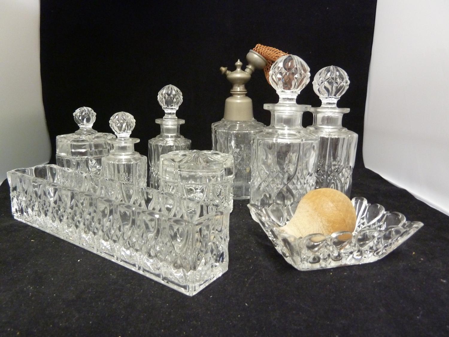 Val St Lambert - a glass dressing table service, colourless, decorated with bands of 'strawberry