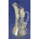 Stevens & Williams - a citrine glass jug, engraved and polished with a bird in prunus and pine