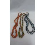 Venetian glass - trade beads, three strings, including a scarlet red string with polychrome spotting