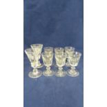 English glass - a set of six deceptive toasting glasses, the octagonal facetted bowl on short stem