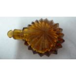 English Glass - an amber glass lay down scent bottle, of star-burst design, original stopper, c.