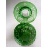 Stevens and Williams - an intaglio cut glass powder bowl cover and underdish, of green cut through