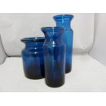 Hovmantorp - three cobalt blue glass vases, of cylindrical form with inverted rims, unmarked, one