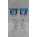 Saint Louis - a pair of blue overlay wine glasses, the bowls cut through to colourless with