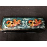 A Russian papier mache lacquer box, rectangular, decorated with two troikas, figures and horses,