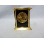 A Swiza 8 traveling alarm clock, brass and black enamel finish, presentation inscription, 8.5cm high