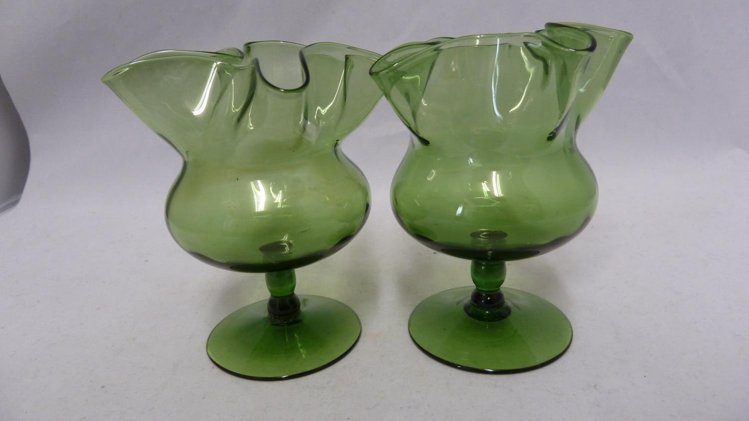 James Powell & Sons, Whitefriars Limited - a pair of green glass posy vases, of crimped star form