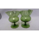 James Powell & Sons, Whitefriars Limited - a pair of green glass posy vases, of crimped star form