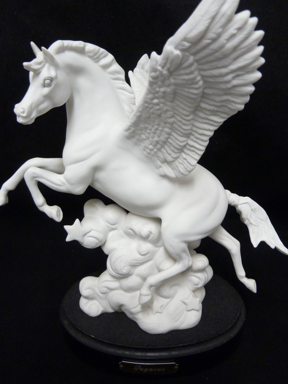 Pegasus - A Royal Doulton figure of a horse with wings atop a cloud with stars, HN3547, together