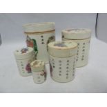 A Chinese porcelain famille rose five piece nesting cannister set, decorated with figures and Chines