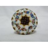 A French enamel box, decorated in Sevres style with a flower form reserve containing a bouquet of